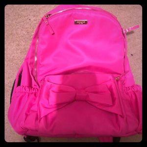 Kate Spade pink backpack with bow.